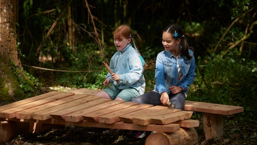 2 girls playing in Nymans Play Glade